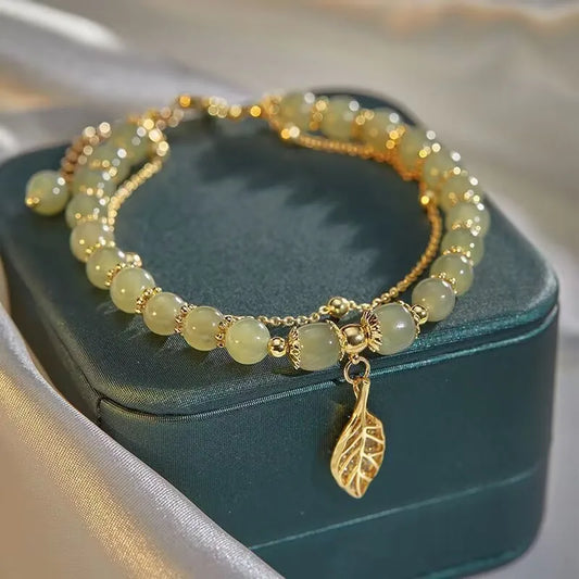 Exquisite Green Jade Bracelet for Women with Gold Color Leaf Accents and Double Chain Design